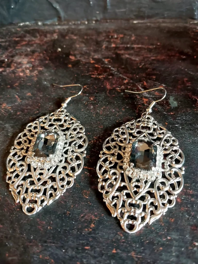 Baroque elegant drop earrings featuring rectangular clear glass stone in an emerald cut.